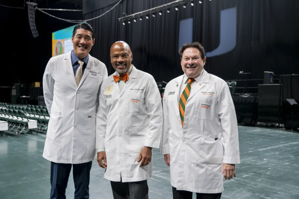 From left, Christopher Chen, M.D. ’00; Henri R. Ford, M.D., M.H.A., dean and chief academic officer of the Miller School; and Edward Dauer, M.D. ’75